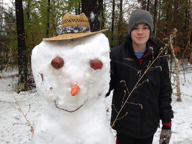 Kid and a snowman.